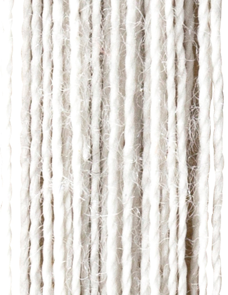 Close-up of white yarn strands on a white background